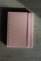 klein notitieboekje met naam